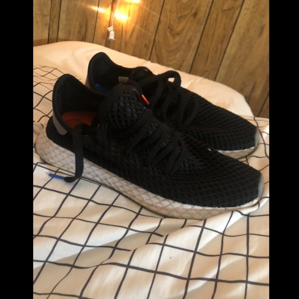 Black Adidas running shoes